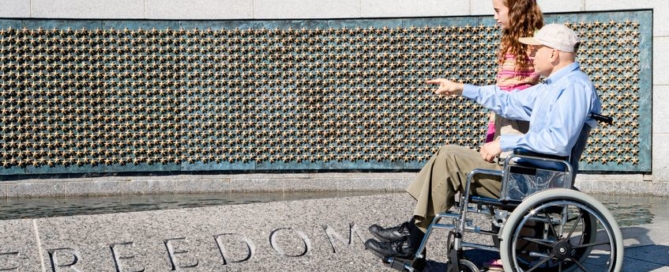 veteran in wheelchair with grand daughter