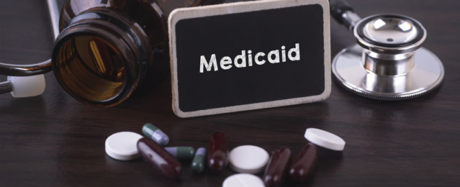 Medicaid sign with pills an stethoscope