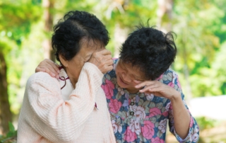 sad senior asian women in outdoor park.