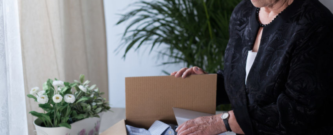 widow is closing box with things of her husband