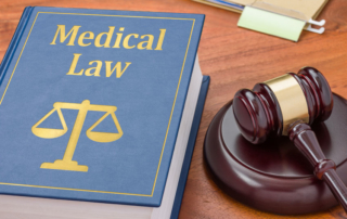 a law book with a gavel - medical law