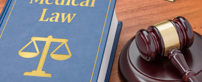a law book with a gavel - medical law