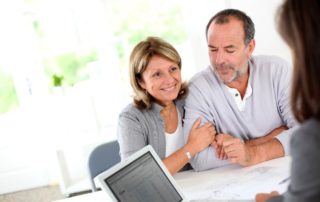 senior couple ready to buy new house reading contract