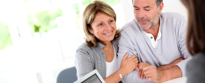 senior couple ready to buy new house reading contract